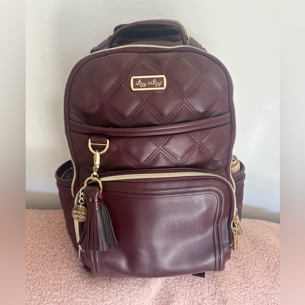 Itzy Ritzy maroon leather diaper bag like new.